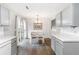 Dining area with table and chairs in kitchen area, view to deck at 7108 Hummingbird Ln, Winston, GA 30187