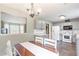 Cozy dining area with table and chairs in kitchen, and view to exterior at 7108 Hummingbird Ln, Winston, GA 30187