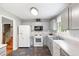 Cozy kitchen with white cabinets, tile floors, modern appliances and plenty of natural light at 7108 Hummingbird Ln, Winston, GA 30187