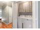 Laundry room showcasing a washer and dryer inside a closet and tile floors at 7108 Hummingbird Ln, Winston, GA 30187