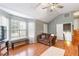 Spacious living room featuring vaulted ceilings, hardwood flooring and abundant natural light at 7108 Hummingbird Ln, Winston, GA 30187
