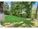 Expansive backyard with well-maintained lawn and mature trees, providing ample space for recreation at 8430 Merion Drive, Duluth, GA 30097