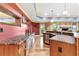 The finished basement features a custom bar area with hardwood floors at 8430 Merion Drive, Duluth, GA 30097