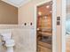Luxury bathroom features a modern toilet and sauna with glass door at 8430 Merion Drive, Duluth, GA 30097