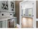 Butler's pantry with wine cooler and marble countertops at 8430 Merion Drive, Duluth, GA 30097