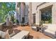Outdoor deck with comfortable lounge chairs, a grill, and scenic views of the surrounding greenery and building at 8430 Merion Drive, Duluth, GA 30097