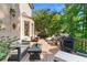 Inviting outdoor deck with ample seating, a grill, and lush greenery, ideal for relaxing and entertaining guests at 8430 Merion Drive, Duluth, GA 30097