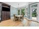 Charming dining area featuring hardwood floors, large windows, and a door leading to the balcony at 8430 Merion Drive, Duluth, GA 30097