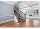 Open foyer with hardwood floors, coffered ceiling, and staircase at 8430 Merion Drive, Duluth, GA 30097