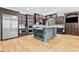 Gourmet kitchen featuring stainless steel appliances, custom cabinets, and a large center island at 8430 Merion Drive, Duluth, GA 30097