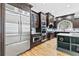 Modern kitchen with stainless steel appliances, custom cabinetry, and hardwood floors at 8430 Merion Drive, Duluth, GA 30097
