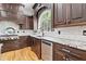 Chef's kitchen showcasing stainless steel appliances, granite countertops, and custom cabinetry at 8430 Merion Drive, Duluth, GA 30097