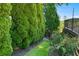 Manicured landscaping showcases lush greenery and vibrant rose bushes bordering the property at 8430 Merion Drive, Duluth, GA 30097