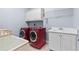 Laundry room equipped with modern washer, dryer, and storage at 8430 Merion Drive, Duluth, GA 30097