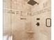 Walk-in shower features tiled walls, shower head, and tasteful bronze hardware at 8430 Merion Drive, Duluth, GA 30097