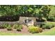 Stone sign for St. Marlo Swim & Tennis nestled amidst lush landscaping and mature trees at 8430 Merion Drive, Duluth, GA 30097
