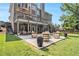 Entertain in this backyard with a spacious patio, lounge area, and lush green lawn at 1006 Kingsbridge Vw, Powder Springs, GA 30127
