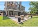 Expansive backyard with a well-maintained lawn, patio seating, and lush landscaping, ideal for outdoor enjoyment at 1006 Kingsbridge Vw, Powder Springs, GA 30127