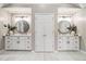 Bright bathroom with double vanity, storage, and modern fixtures at 1006 Kingsbridge Vw, Powder Springs, GA 30127