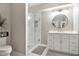 Modern bathroom with glass-enclosed shower, white vanity, and updated fixtures at 1006 Kingsbridge Vw, Powder Springs, GA 30127