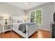 Cozy bedroom with a window view and hardwood floors at 1006 Kingsbridge Vw, Powder Springs, GA 30127