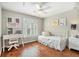 Charming bedroom with hardwood floors, desk, and daybed with window views at 1006 Kingsbridge Vw, Powder Springs, GA 30127