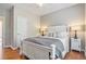 Comfortable bedroom with white furniture, hardwood floors, and a ceiling fan at 1006 Kingsbridge Vw, Powder Springs, GA 30127