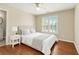 Serene bedroom with hardwood floors, neutral decor, and lots of natural light at 1006 Kingsbridge Vw, Powder Springs, GA 30127