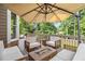 Relaxing outdoor deck space featuring a fire pit and comfortable seating arrangement, perfect for entertaining guests at 1006 Kingsbridge Vw, Powder Springs, GA 30127