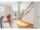 Bright foyer with high ceilings, showcasing a staircase with wood and iron railing at 1006 Kingsbridge Vw, Powder Springs, GA 30127