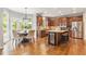 Bright eat-in kitchen with wooden cabinets, stainless steel appliances, and hardwood floors at 1006 Kingsbridge Vw, Powder Springs, GA 30127