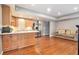Open-concept kitchen with stainless steel appliances and adjacent living area at 1006 Kingsbridge Vw, Powder Springs, GA 30127