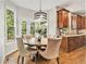 Breakfast nook showcasing a round table with chairs, hardwood floors, and natural light from windows at 1006 Kingsbridge Vw, Powder Springs, GA 30127