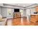 Spacious living room with hardwood floors, ample natural light, and a cozy seating area at 1006 Kingsbridge Vw, Powder Springs, GA 30127