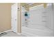 Bright bathroom featuring a tub with white tile surround and a window bringing in natural light at 1414 Dolcetto Nw Trce # 14, Kennesaw, GA 30152