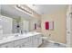 This bathroom features a double sink vanity, ample lighting, and neutral color palette at 1414 Dolcetto Nw Trce # 14, Kennesaw, GA 30152
