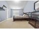 This stylish bedroom features a serene atmosphere with neutral tones, a large dresser, and ample closet space at 1414 Dolcetto Nw Trce # 14, Kennesaw, GA 30152