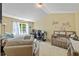 This cozy bedroom is a comfortable space for both rest and creative pursuits at 1414 Dolcetto Nw Trce # 14, Kennesaw, GA 30152
