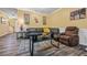 Comfortable living room featuring ample seating, wood-look floors, and neutral paint at 1414 Dolcetto Nw Trce # 14, Kennesaw, GA 30152