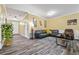 Spacious living area with wood-look floors, comfortable seating, and neutral wall colors at 1414 Dolcetto Nw Trce # 14, Kennesaw, GA 30152