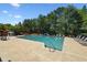 Community pool surrounded by lounge chairs and lush greenery, perfect for relaxation at 1414 Dolcetto Nw Trce # 14, Kennesaw, GA 30152