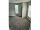 Bedroom featuring two windows allowing natural light and new carpet at 2268 Newnan St, Atlanta, GA 30344