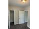 Bedroom featuring plush carpeting and access to a closet, providing ample storage space at 2268 Newnan St, Atlanta, GA 30344