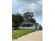 Attractive single-story home boasting a quaint front porch and green lawn at 2268 Newnan St, Atlanta, GA 30344