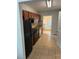 The kitchen features wood cabinets, black appliances and tile floors at 2268 Newnan St, Atlanta, GA 30344
