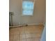 Laundry room with tile flooring, window and dryer vent at 2268 Newnan St, Atlanta, GA 30344