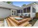 Outdoor living space with a spacious wooden deck featuring string lights, ideal for entertaining and relaxation at 764 Stokeswood Se Ave, Atlanta, GA 30316