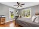 Comfortable bedroom with a ceiling fan, natural light, and hardwood floors at 764 Stokeswood Se Ave, Atlanta, GA 30316
