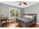 Comfortable bedroom with a ceiling fan, natural light, and hardwood floors at 764 Stokeswood Se Ave, Atlanta, GA 30316