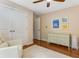 Bright bedroom boasts a white rug, cream dresser, and comfortable seating with good natural light at 764 Stokeswood Se Ave, Atlanta, GA 30316
